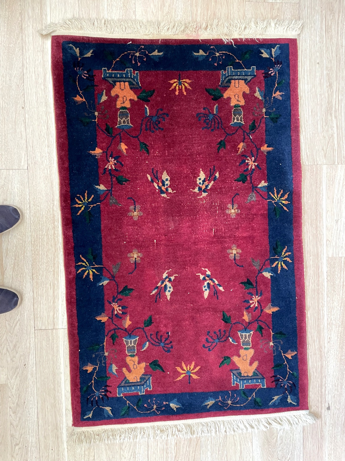 Full perspective of an antique Art Deco Chinese rug displayed as an accent piece, measuring approximately 3 x 5 feet, ideal beside a bed, in front of a fireplace, or as a textile art object.


