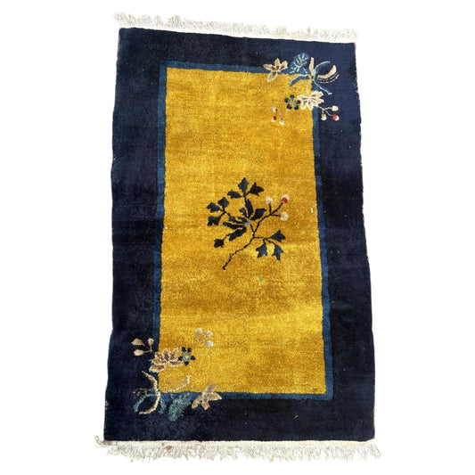 Full Chinese Art Deco wool rug with gold field, navy border and floral sprays, 1B1007