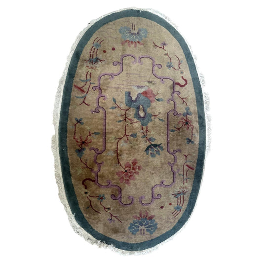 Full oval Chinese Art Deco floral wool rug with beige field and teal border, 1B1008