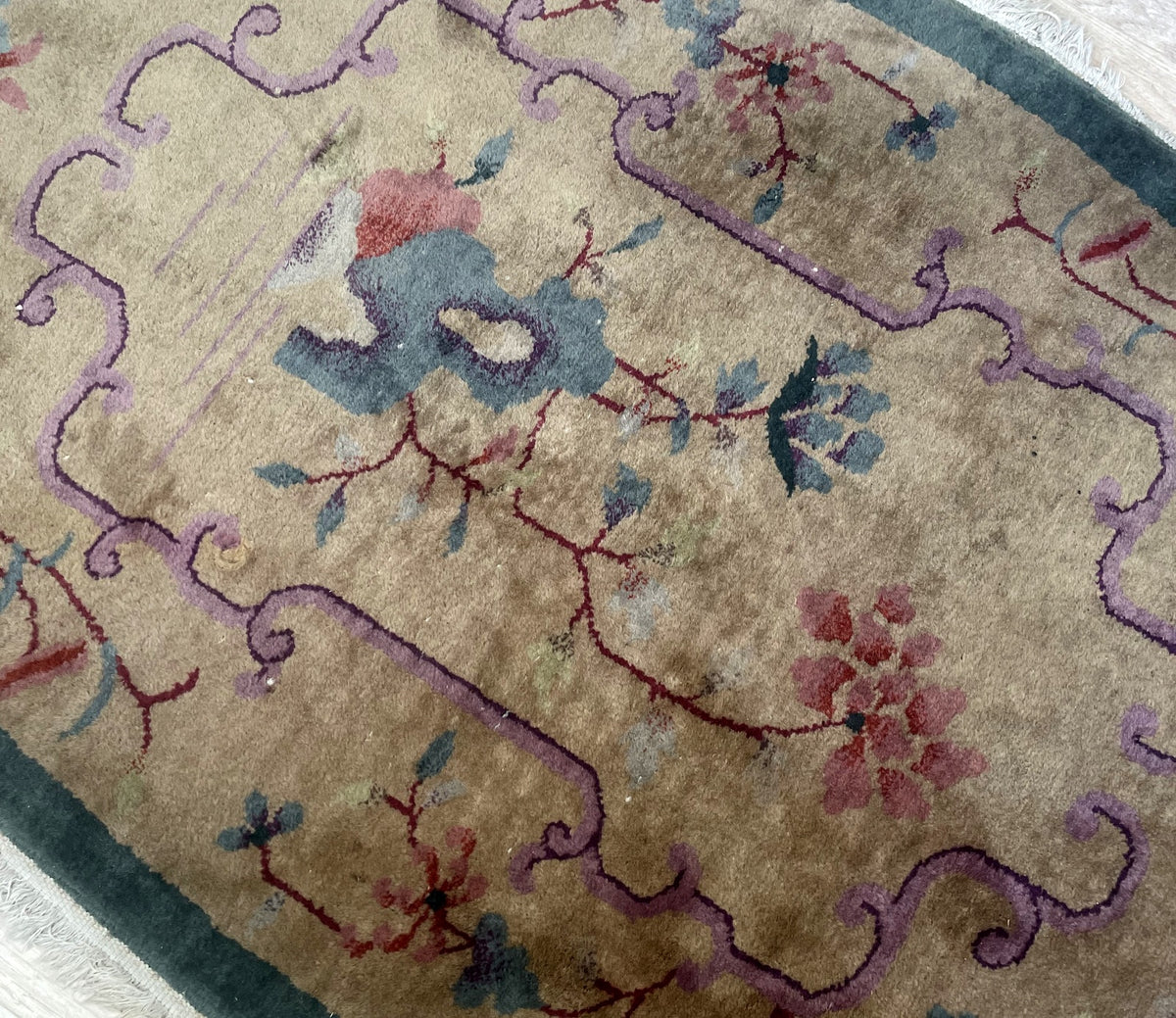 Complete oval composition with beige ground, pastel flowers and teal frame