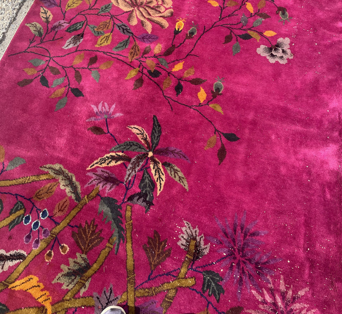 Detailed floral cluster with branching stems and age-related wear on rug 1B1009