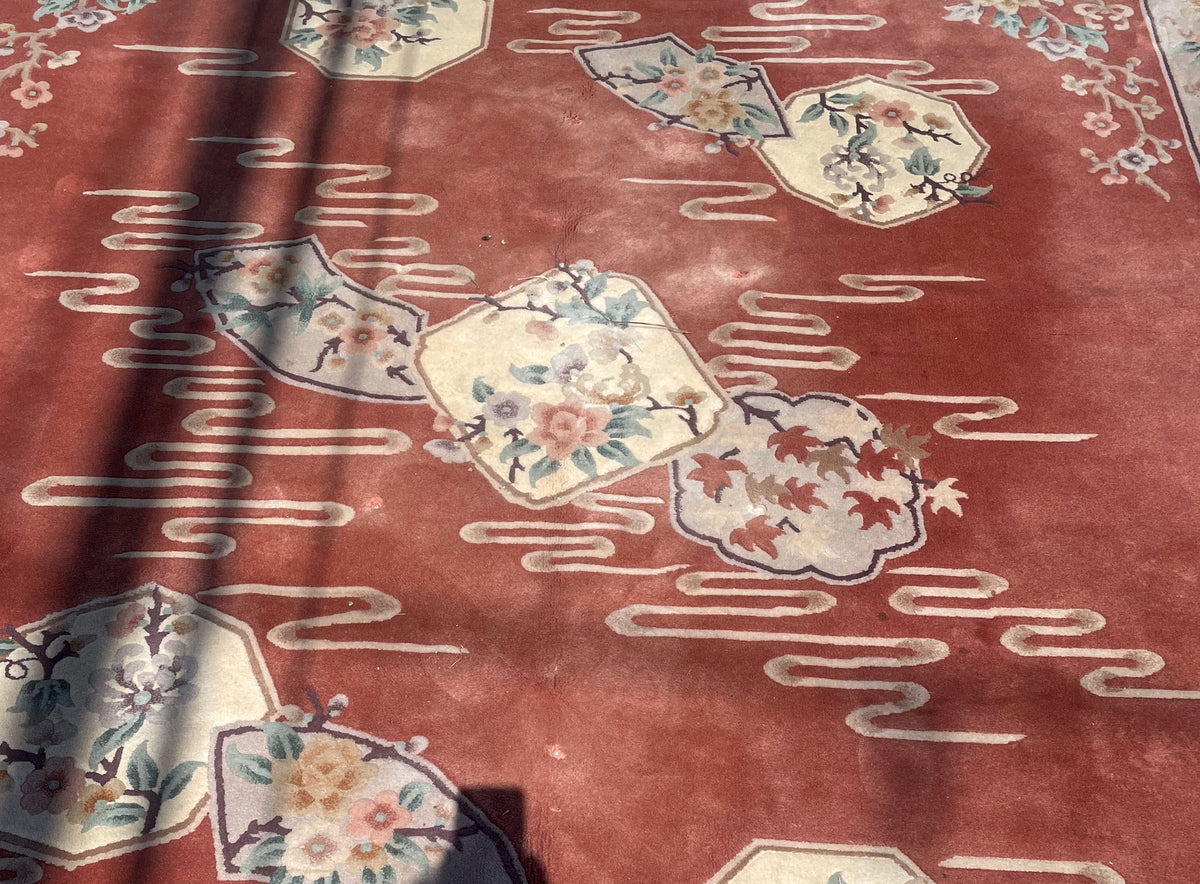 Central group of ivory floral and leaf panels with visible surface wear and small pile losses