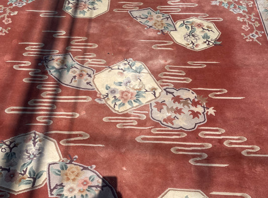 Central group of ivory floral and leaf panels with visible surface wear and small pile losses