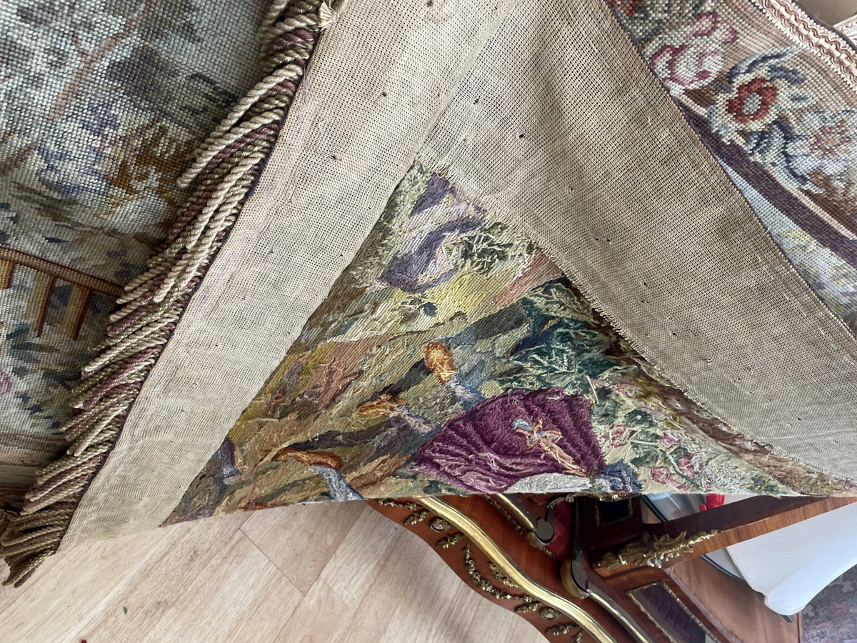 Reverse view showing fabric backing lifted over coloured yarns