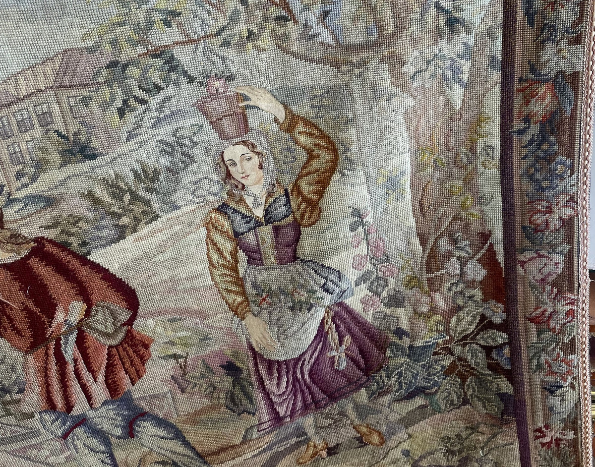 Close-up of the woman's plum skirt and cream apron