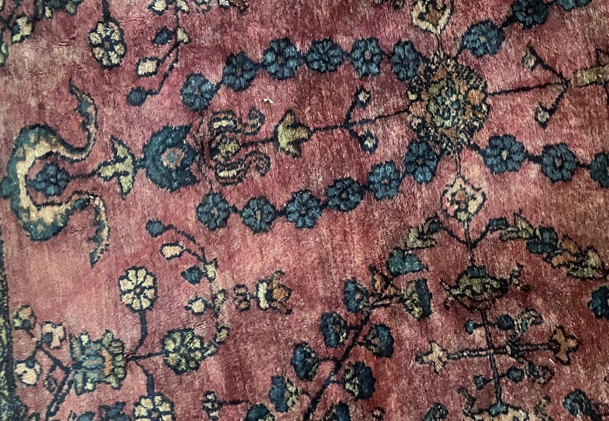 Wool pile showing tonal variation across the rose background