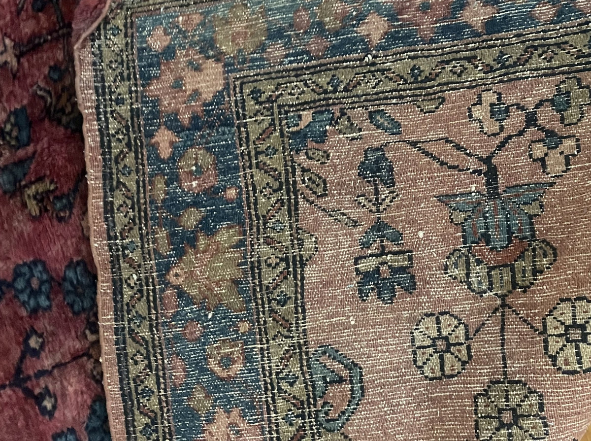 Reverse close-up showing floral drawing and rows of knots
