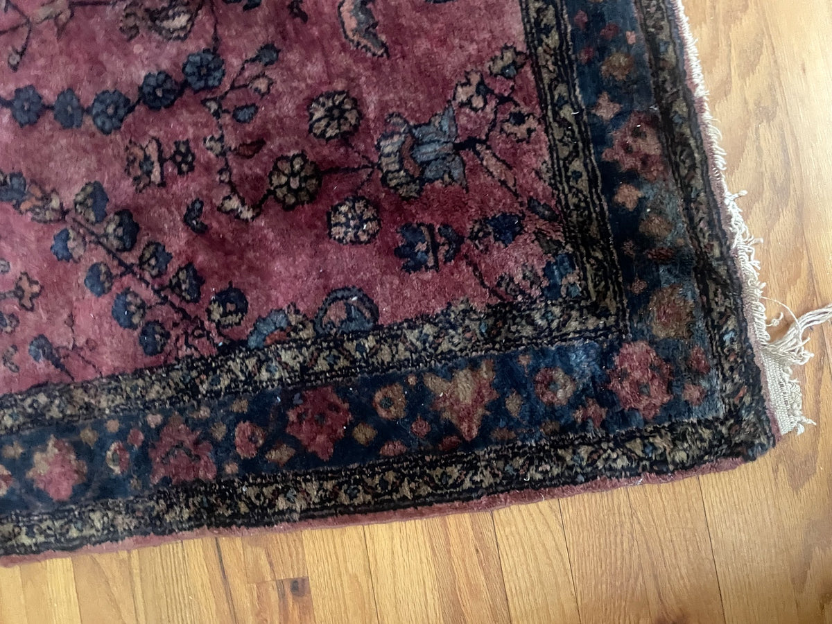 Corner showing patterned guard borders and uneven fringe remnants