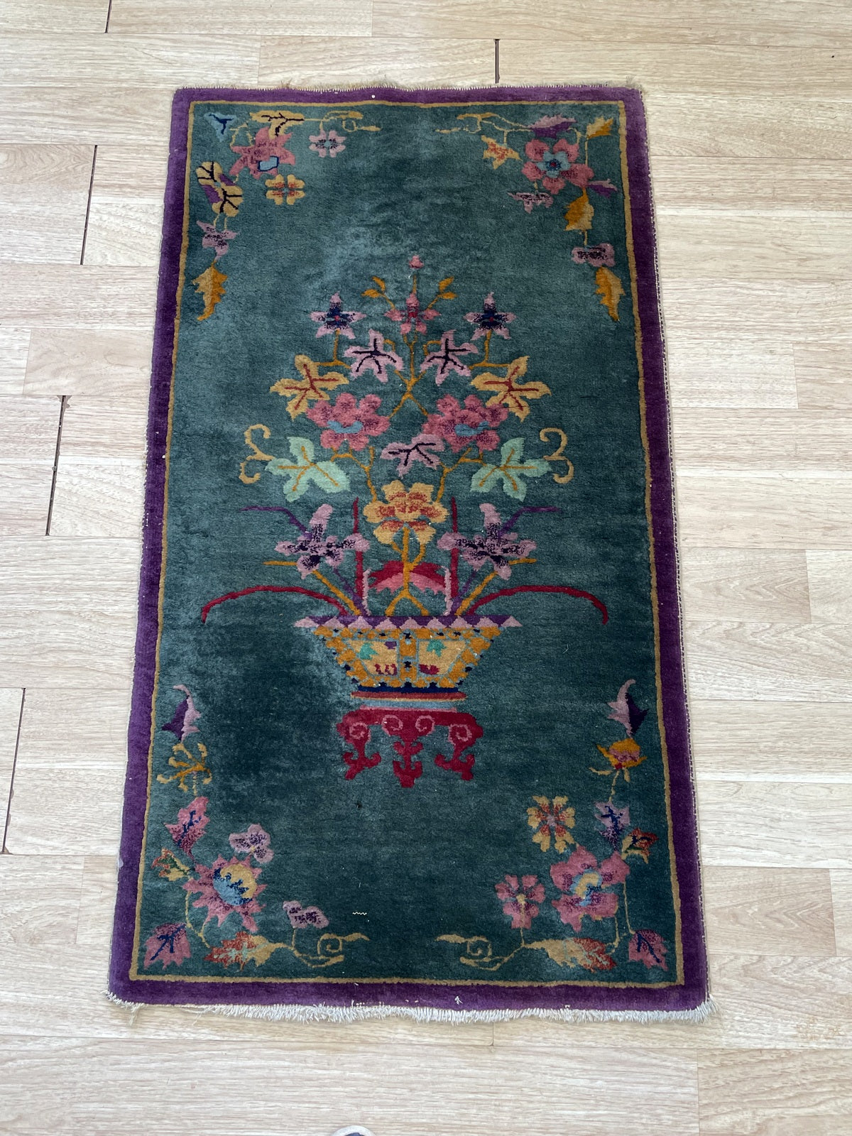 Full-length view showing purple border and floral corner sprays