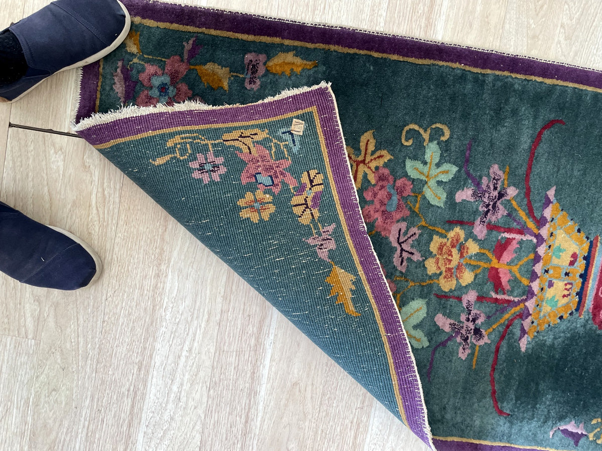 Folded corner revealing the patterned knotted reverse