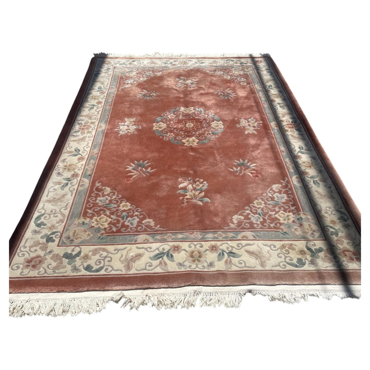Chinese wool rug 1B1015 with coral field, circular floral medallion and ivory border