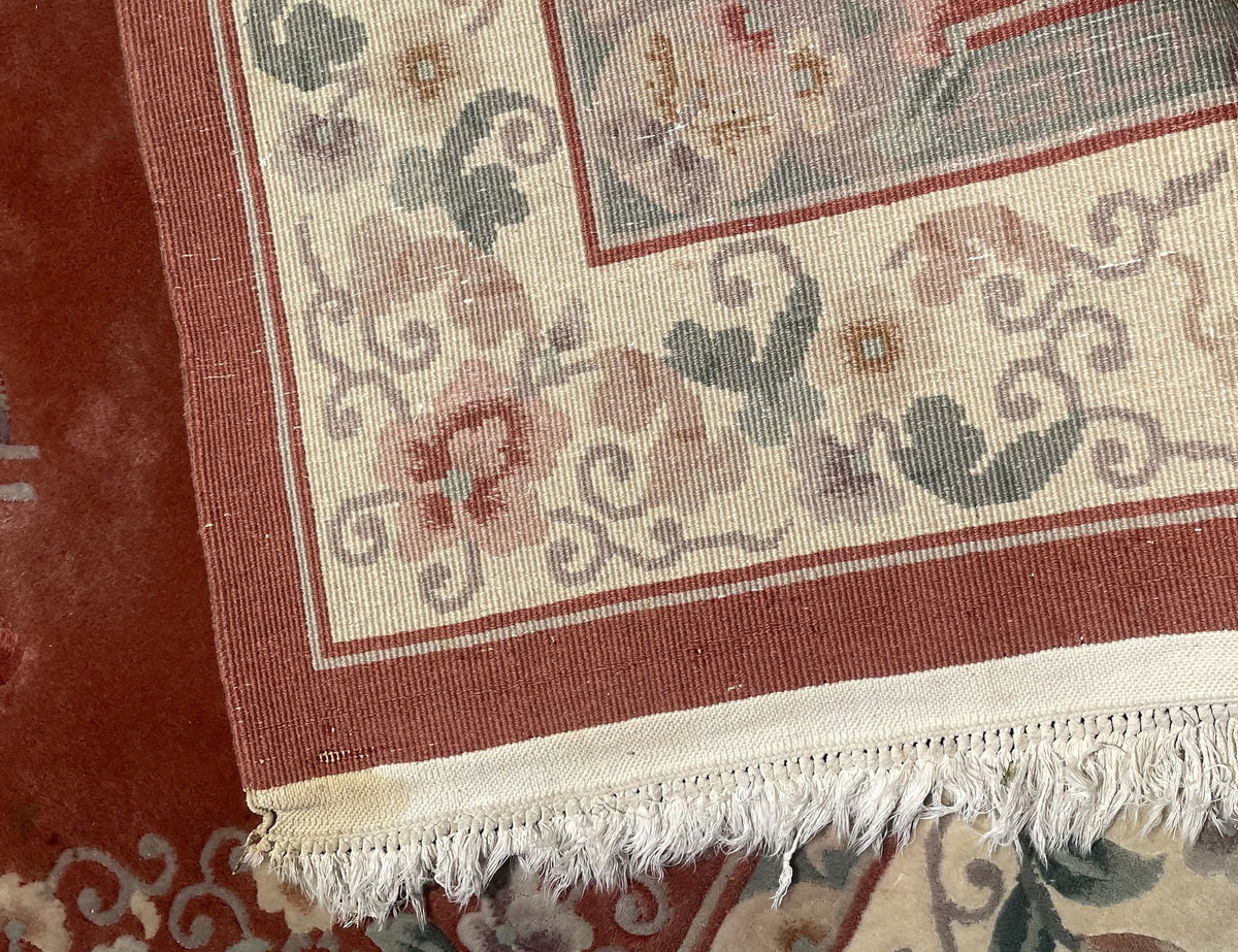 Reverse corner showing border pattern and uneven fringe