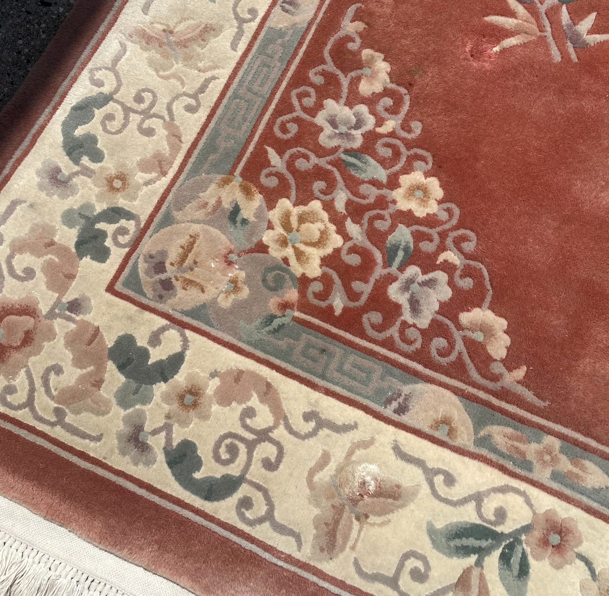 Corner ornament with sculpted flowers and scrolling foliage