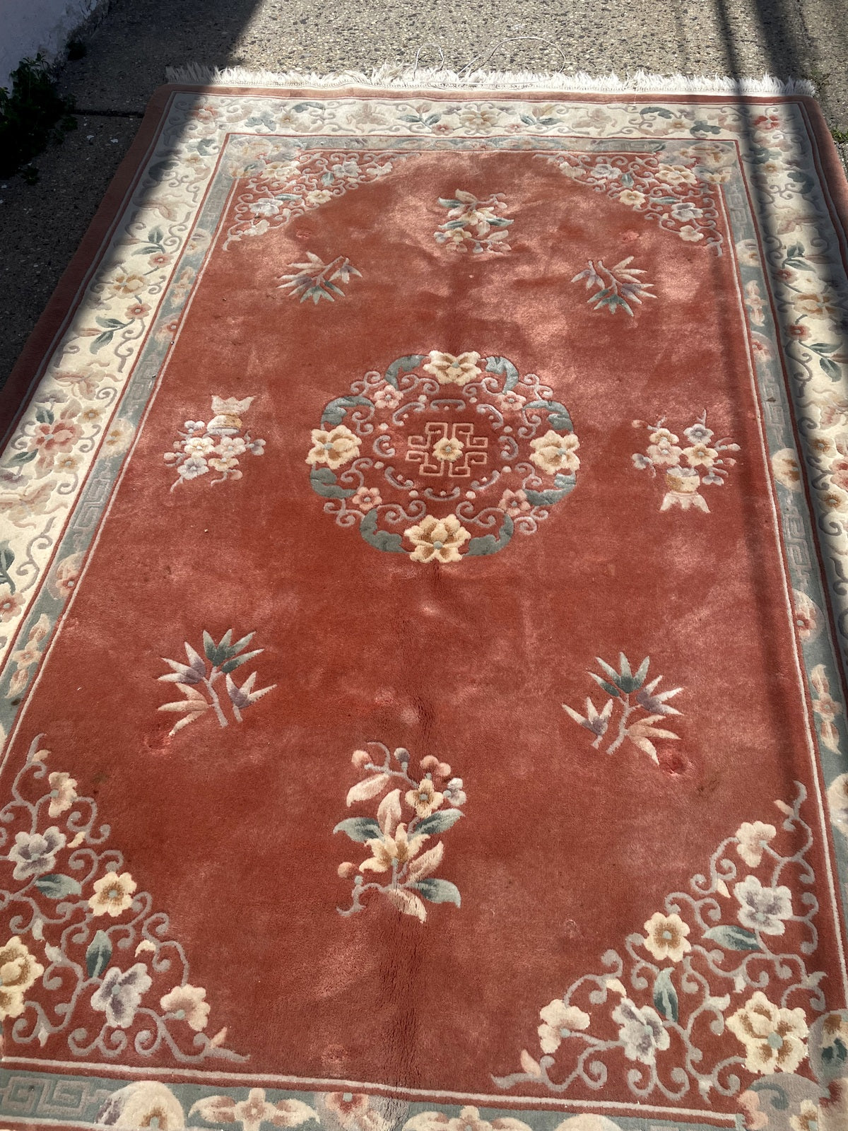Overall view showing scattered botanical motifs around the central medallion