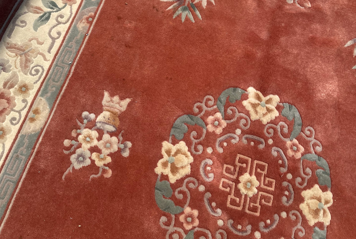 Circular medallion with cream blossoms and geometric centre