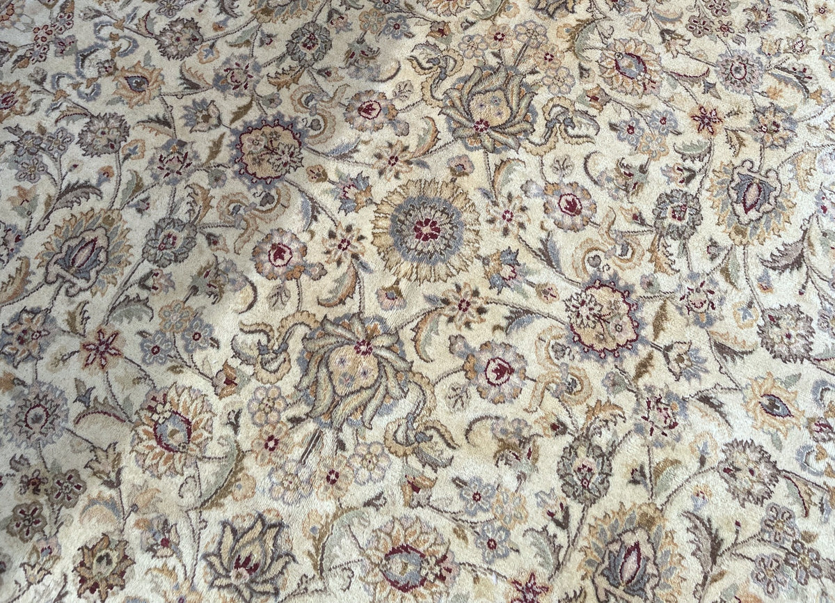 Rounded rosettes and layered palmettes on ivory wool