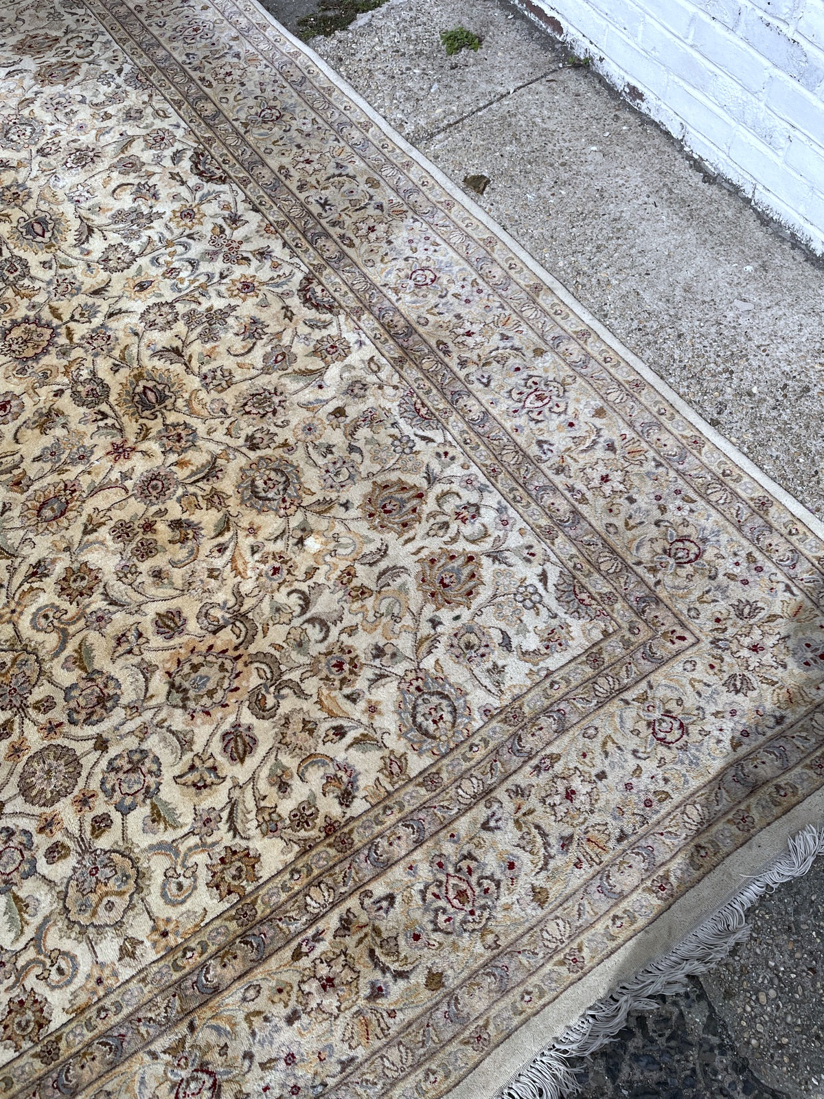 Right corner with scrolling floral field and patterned guard borders