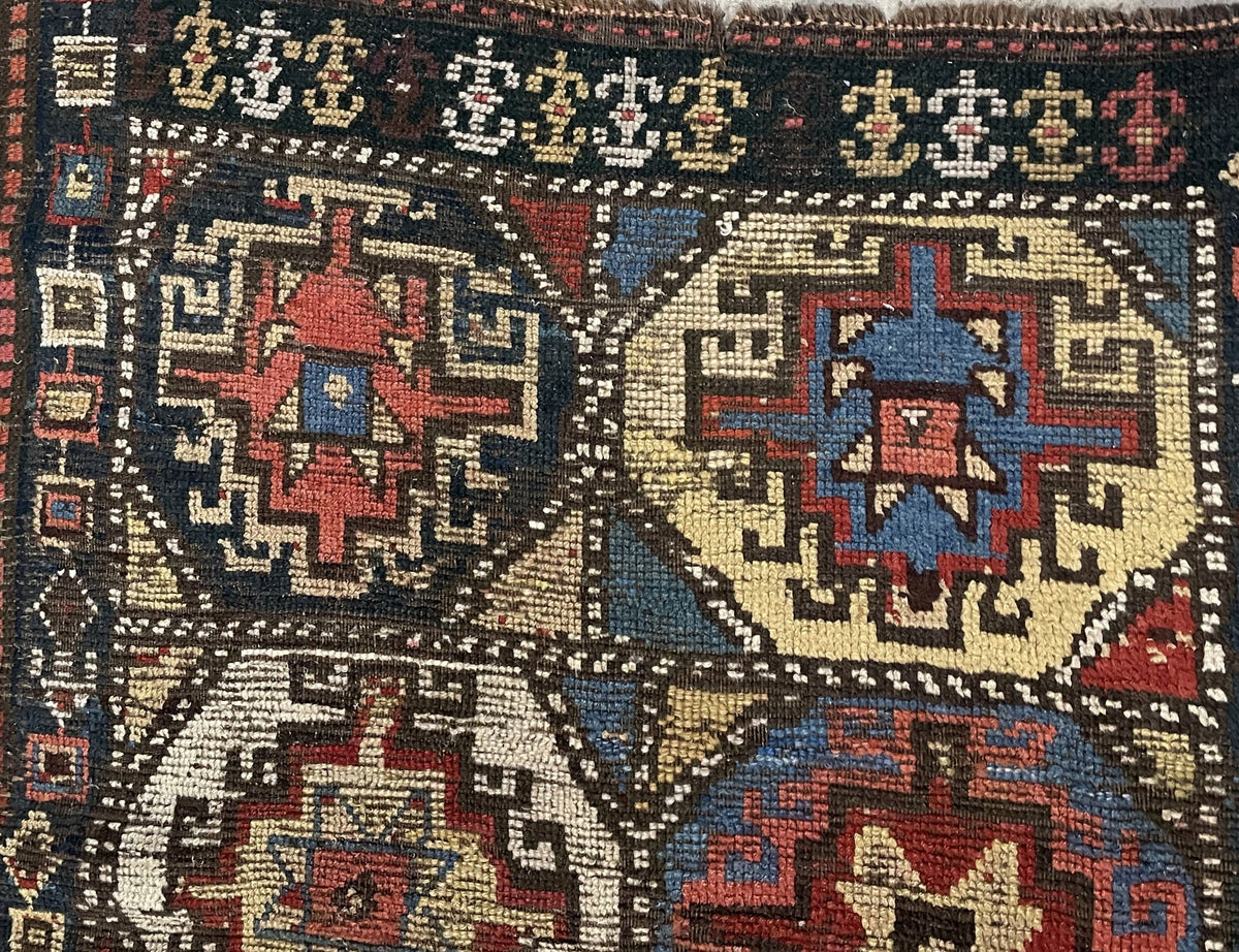 Four geometric medallions with exposed foundation between coloured motifs
