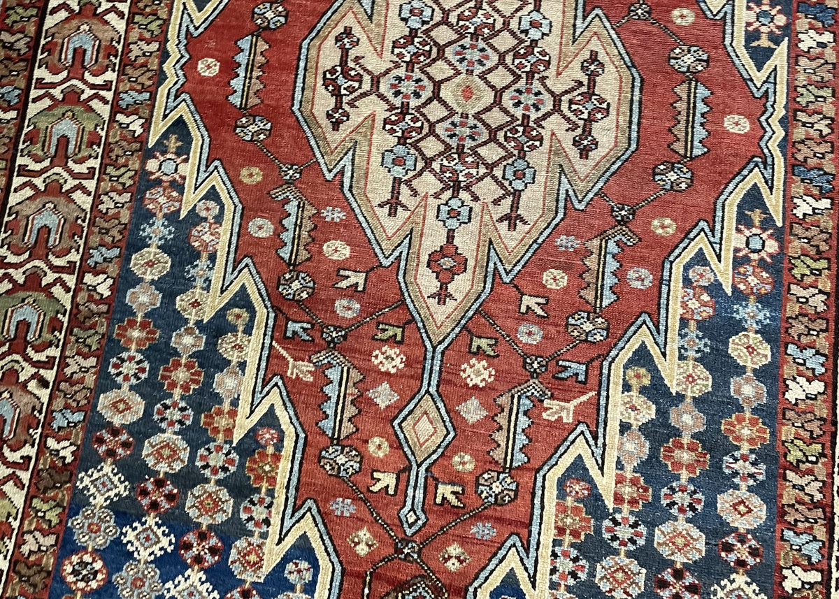 Lower red field with diamond pendant and angular floral ornaments