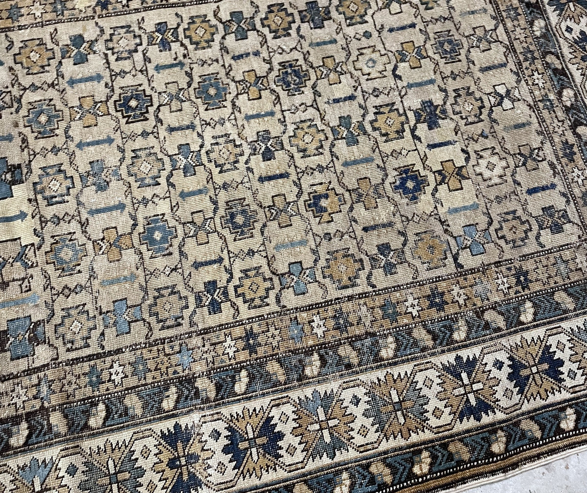Patterned wool surface with geometric motifs and visible age-related wear