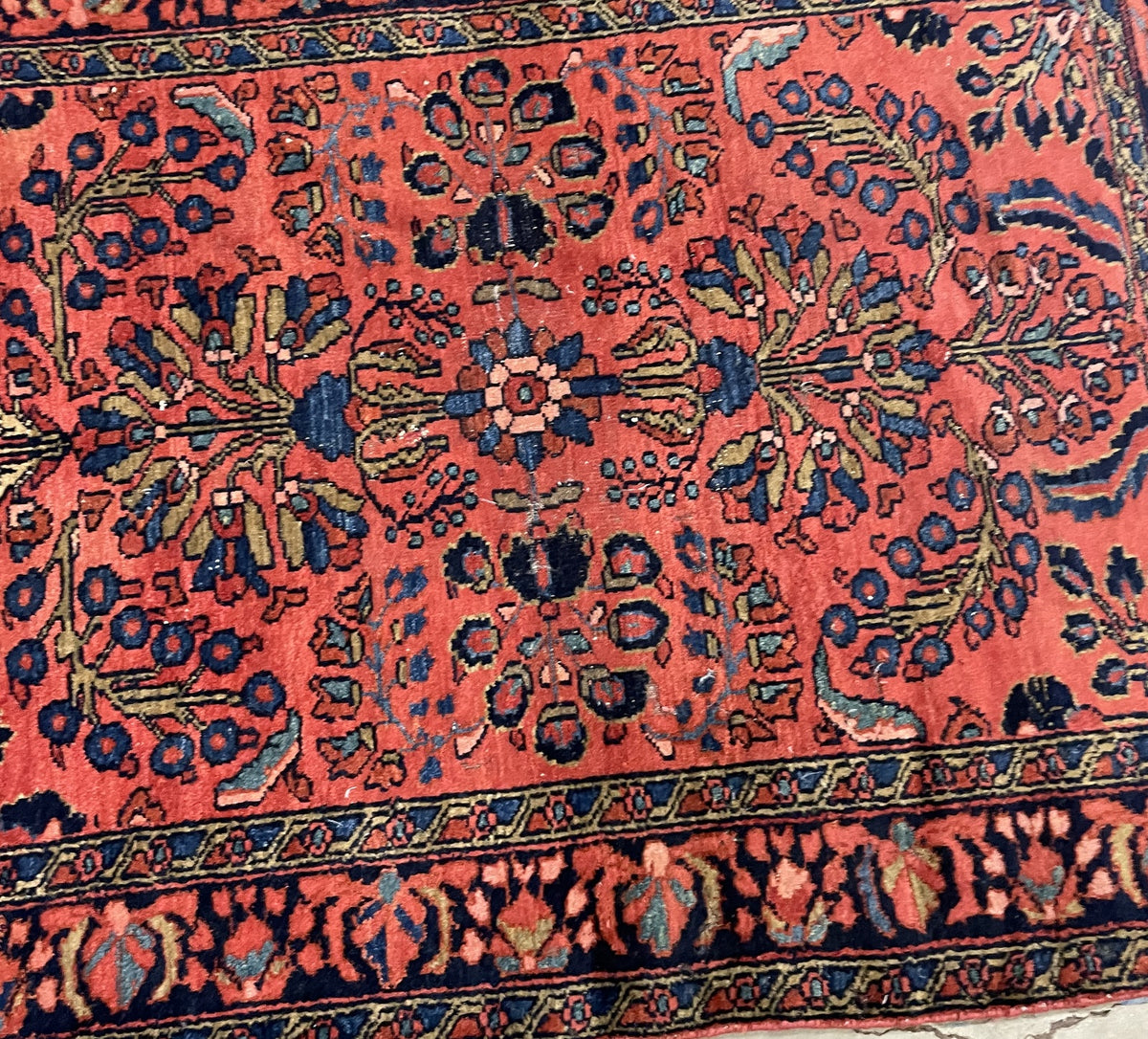 Folded corner revealing the patterned reverse and closely worn end