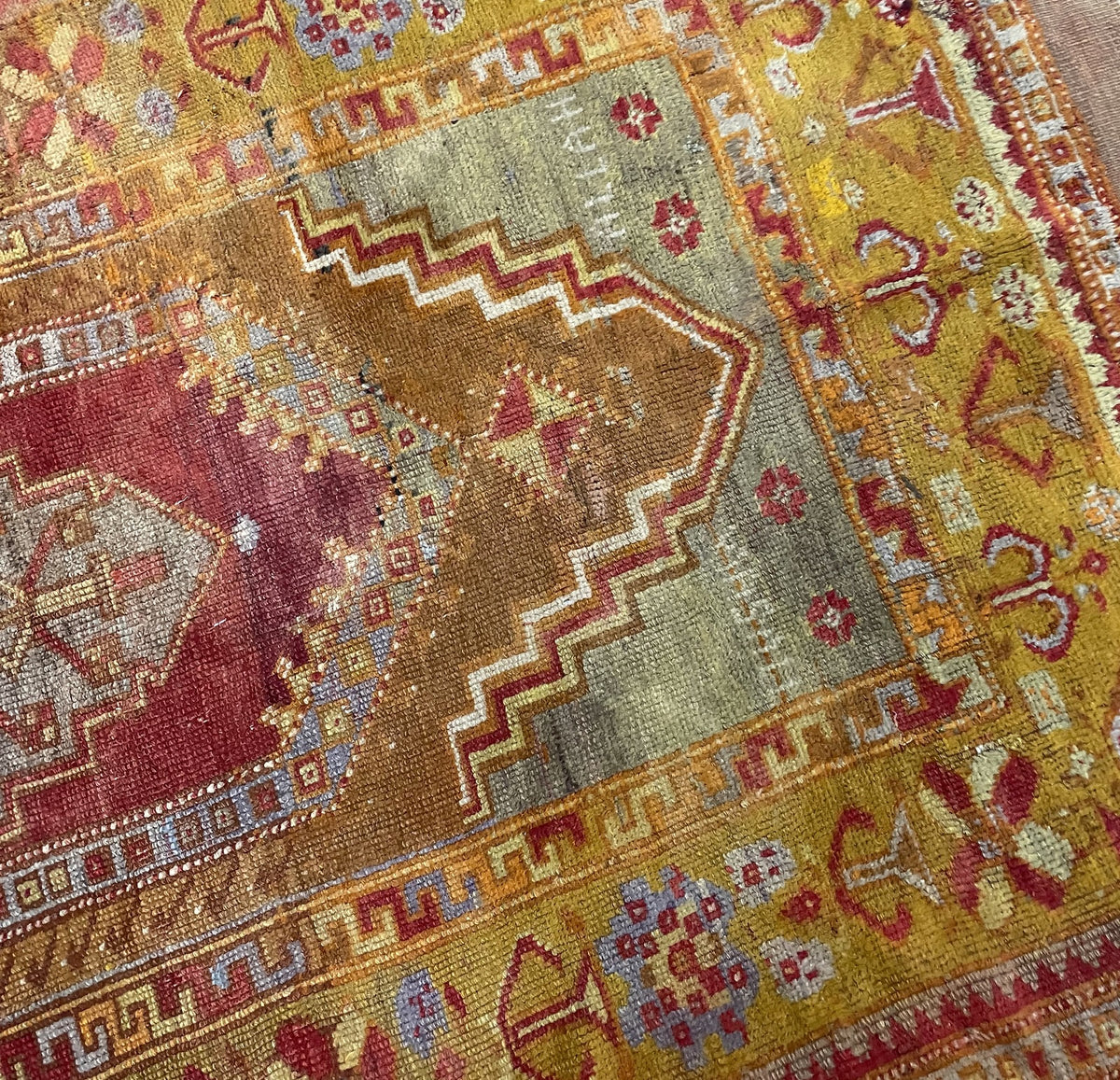 Wider reverse view showing pale fringe and the flatwoven end finish