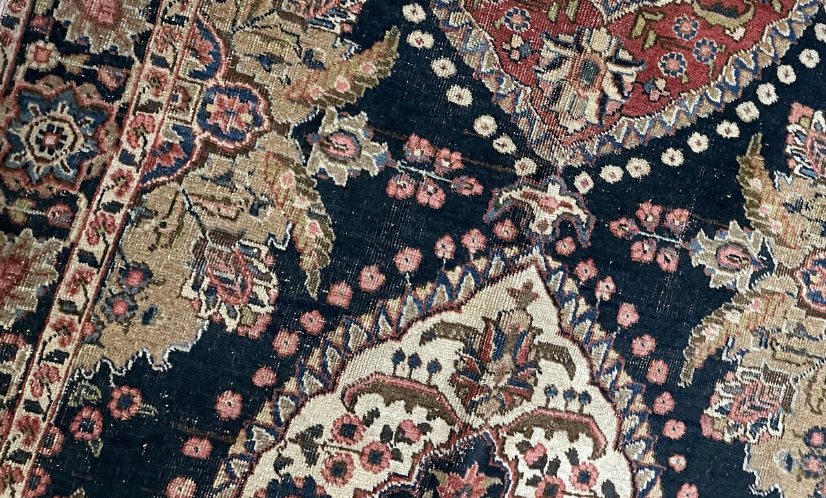 Ochre end panel surrounded by ivory rosette trails and gold-toned botanical forms.