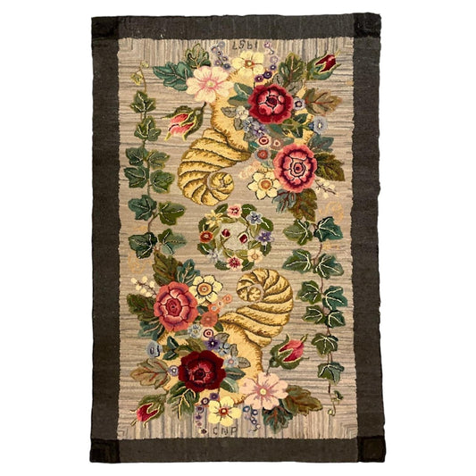 American hooked wool rug with paired golden floral cornucopias, central wreath and charcoal-brown border.