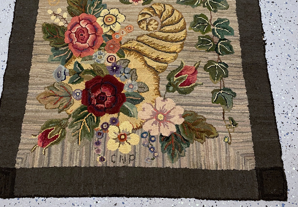 Full view from the dated end showing the 1957 inscription and paired floral design.