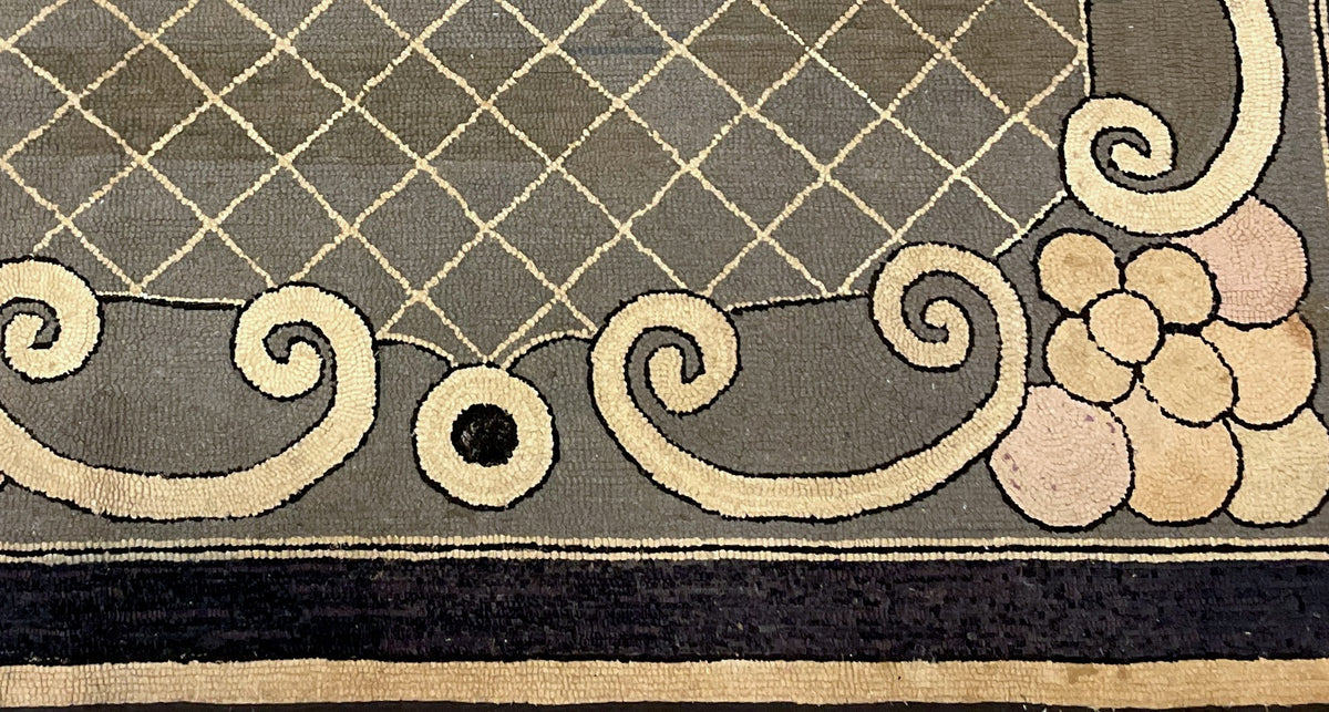 Detailed floral corner showing rounded pale petals, grey ground and dark perimeter binding.