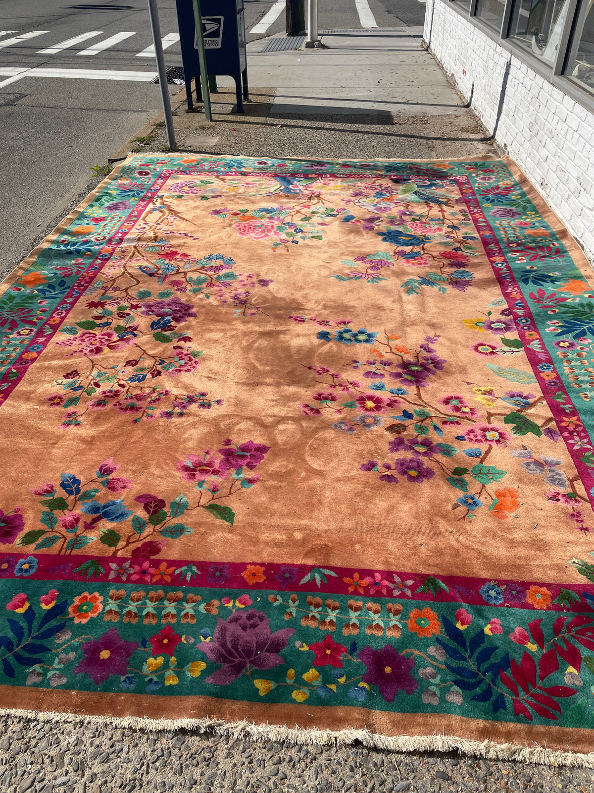 Full-length Chinese Art Deco rug showing an open peach field framed by jade and burgundy floral borders.