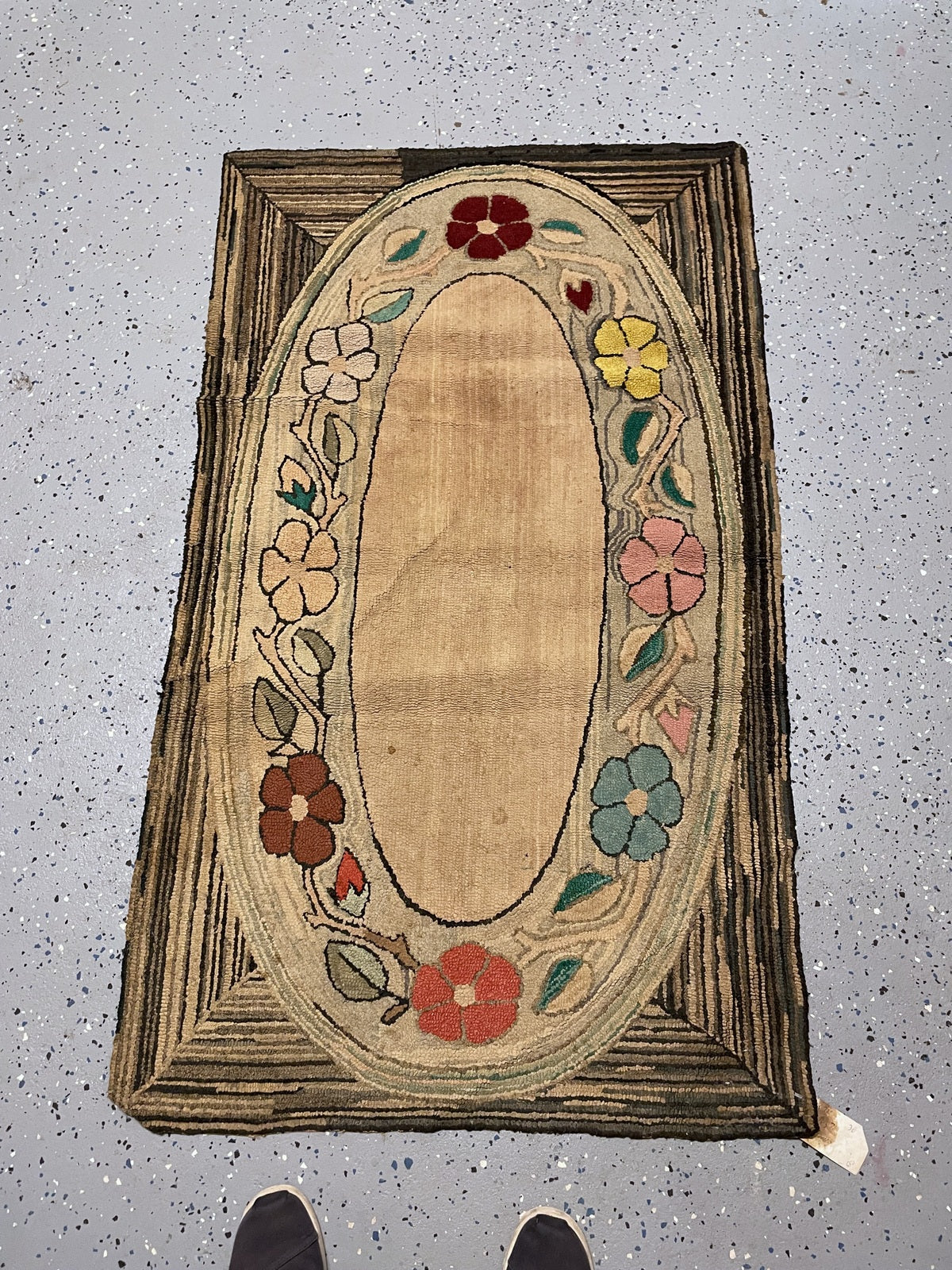 Lower oval with coral and blue flowers framed by cream, taupe and brown corner bands.
