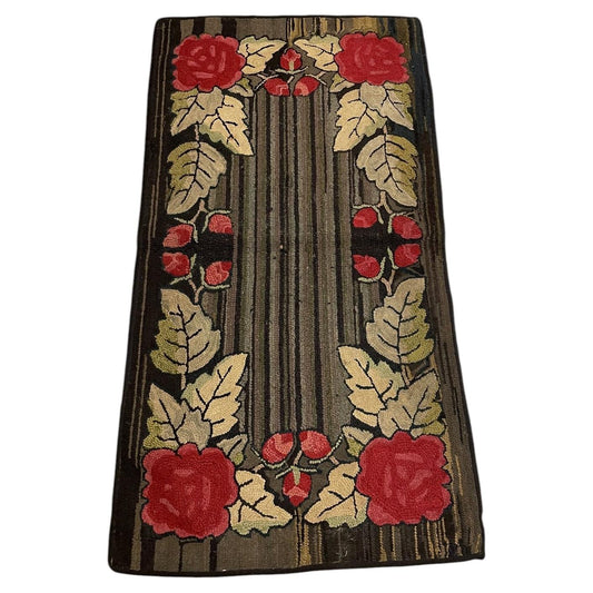 Full American hooked wool rug with four red roses, cream leaves and a lengthwise striped brown and charcoal centre.