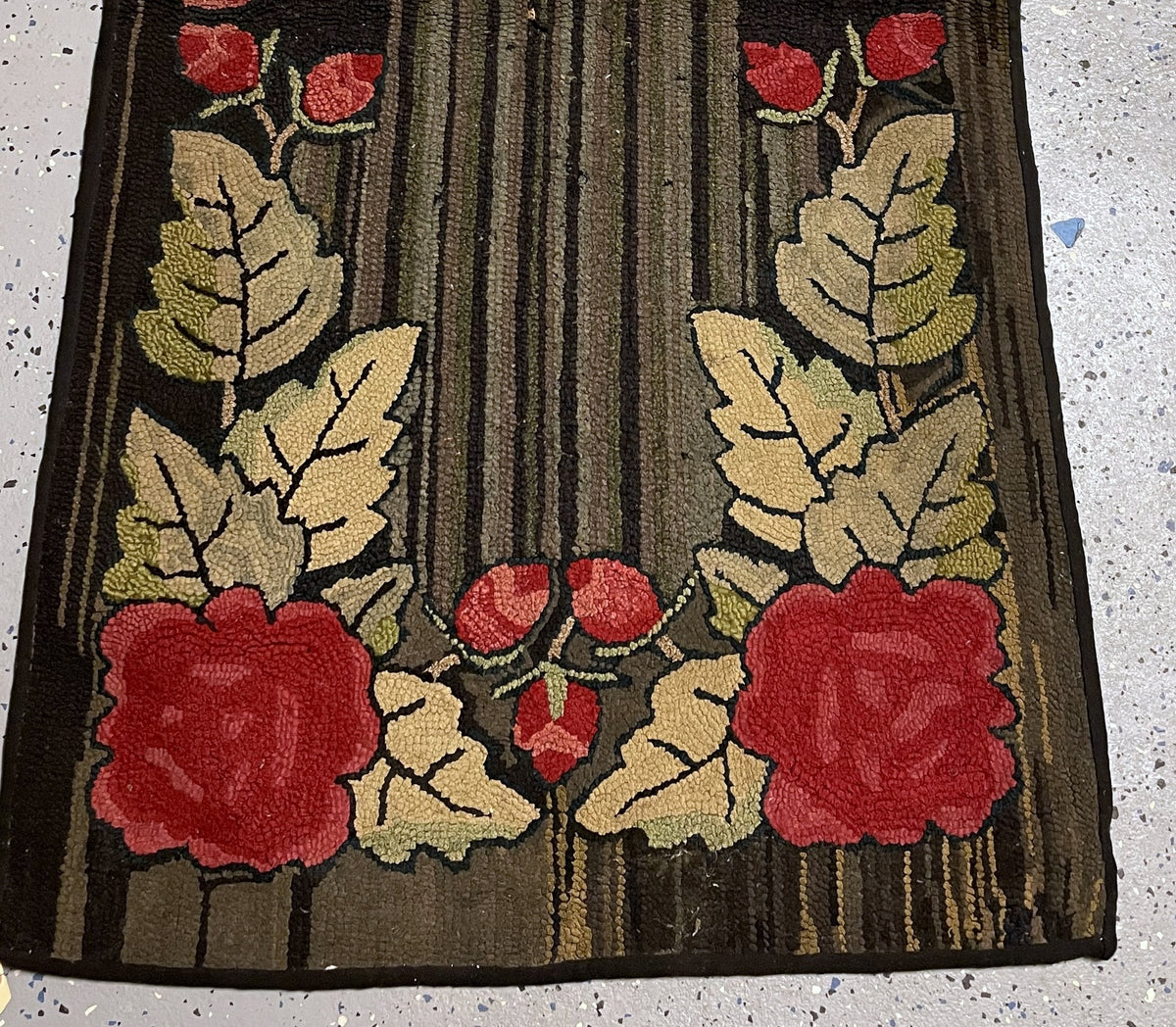 Lower floral panel with red roses, coral buds, veined pale leaves and worn striped wool.
