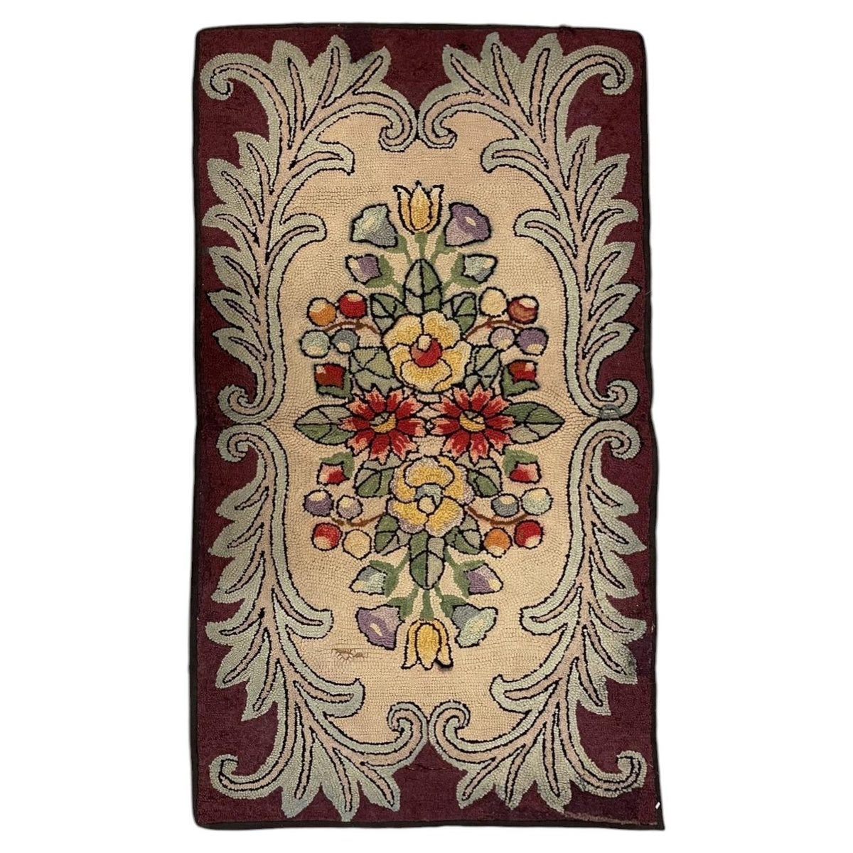 Full American hooked wool rug with mirrored colourful flowers on cream, pale sage acanthus scrolls and a burgundy border.