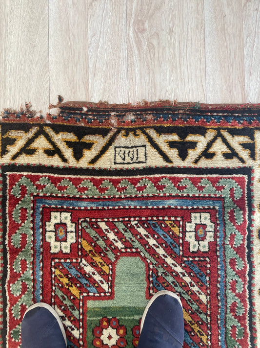 Detail of a handmade 19th-century Borchalu Kazak rug from the Caucasus region, circa 1860s.

