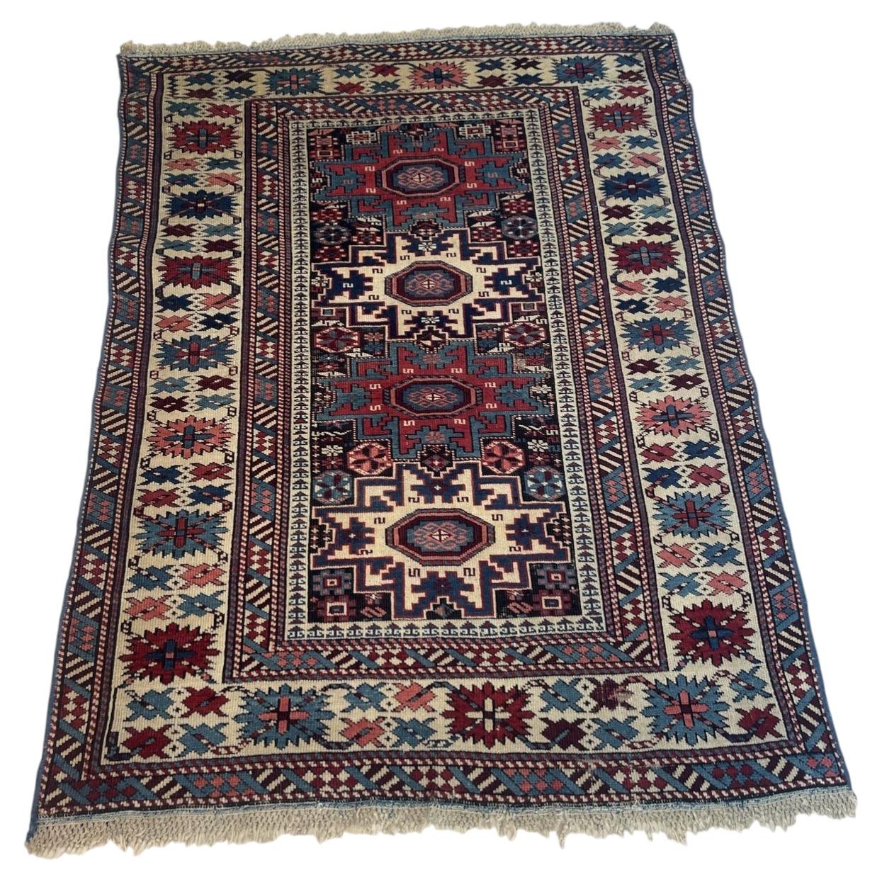 Antique Caucasian Lezgi Star rug 1880s hand-knotted wool 4x5.7 ft full view with geometric medallions

