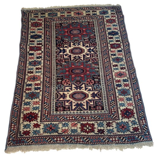 Antique Caucasian Lezgi Star rug 1880s hand-knotted wool 4x5.7 ft full view with geometric medallions

