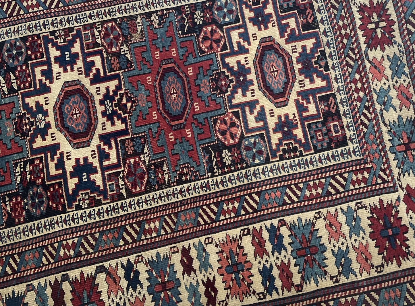 Handmade Lezgi rug Caucasus circa 1880s with deep indigo madder red ivory and ochre colors

