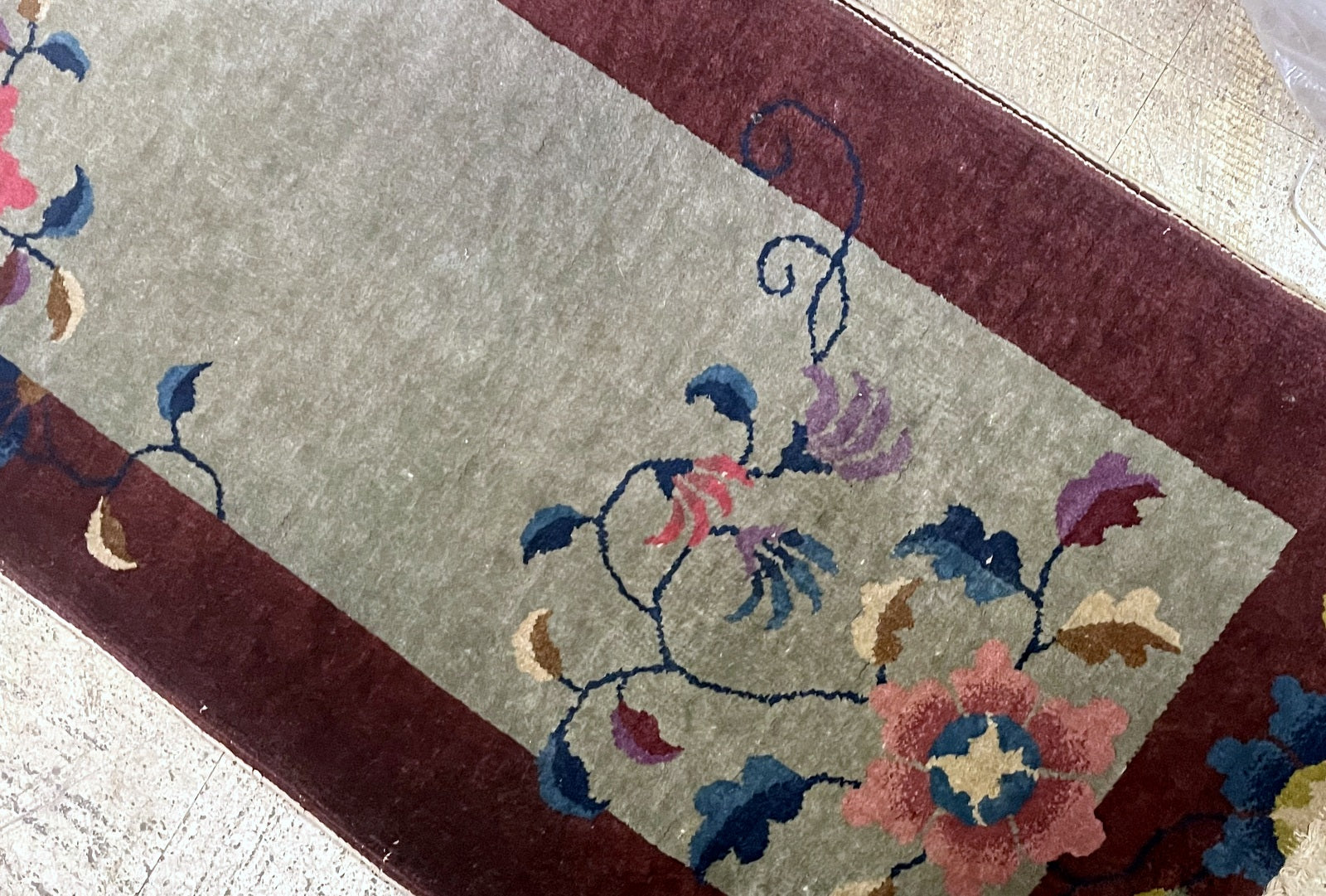 Handmade Chinese rug circa 1920s with celadon green oxblood red peony pink and indigo colors

