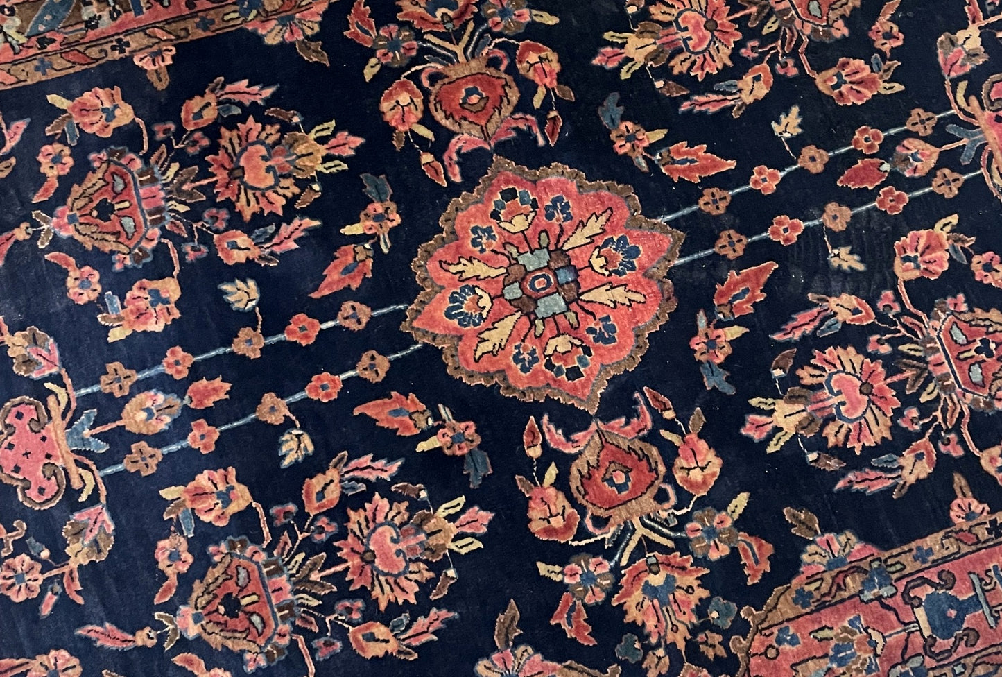 Handmade Mahajiran rug Sarouk region Persia circa 1900 with midnight blue antique rose and indigo colors

