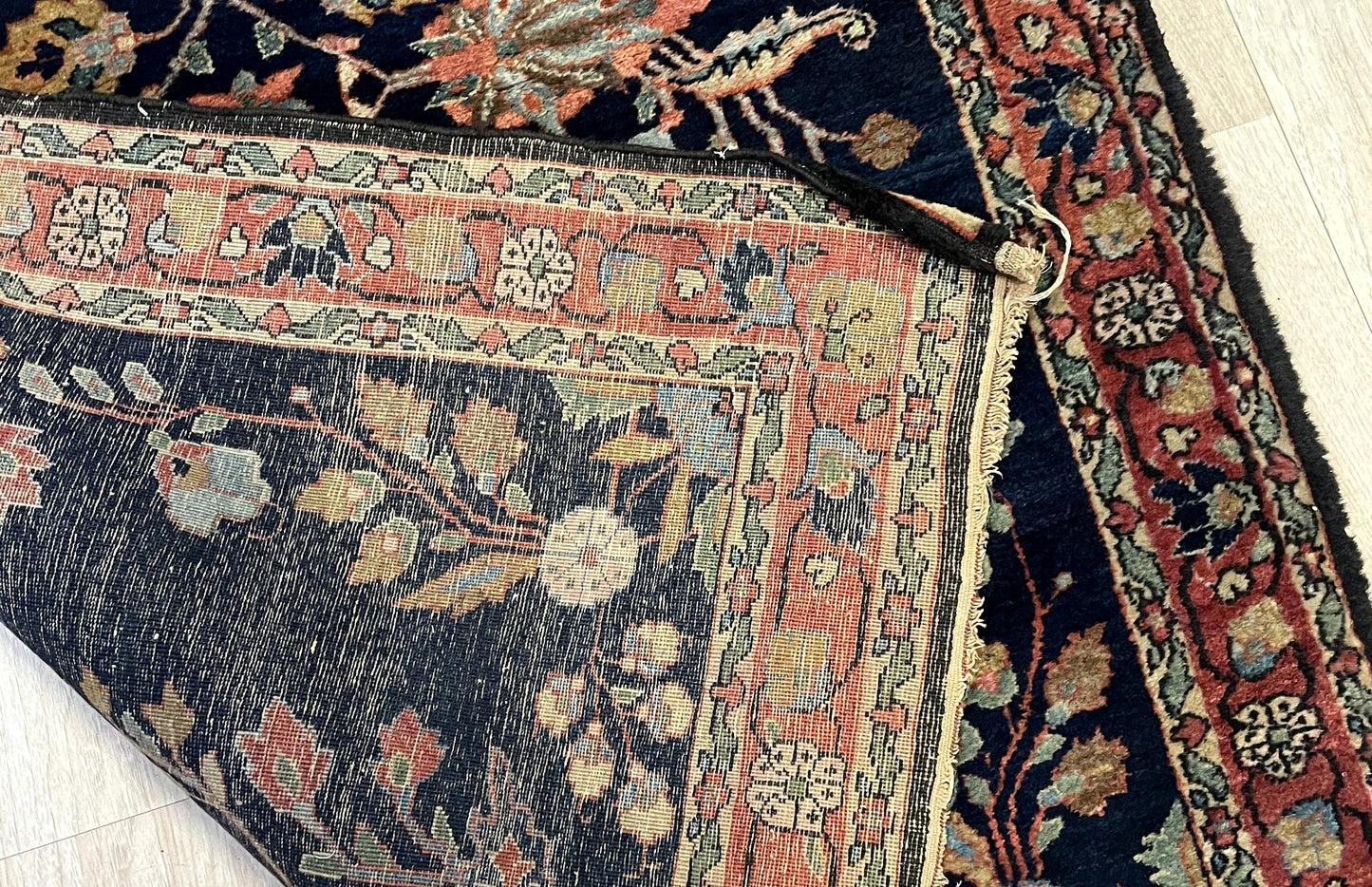 Early 20th century Persian Mahajiran rug with luminous pile and sophisticated floral sprig design on floor

