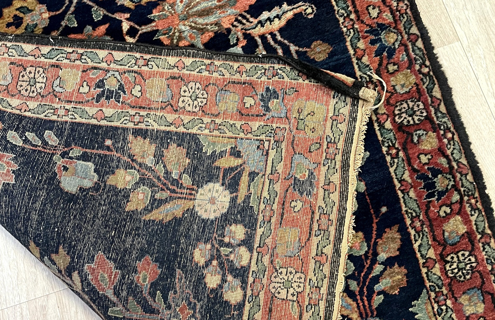 Early 20th century Persian Mahajiran rug with luminous pile and sophisticated floral sprig design on floor

