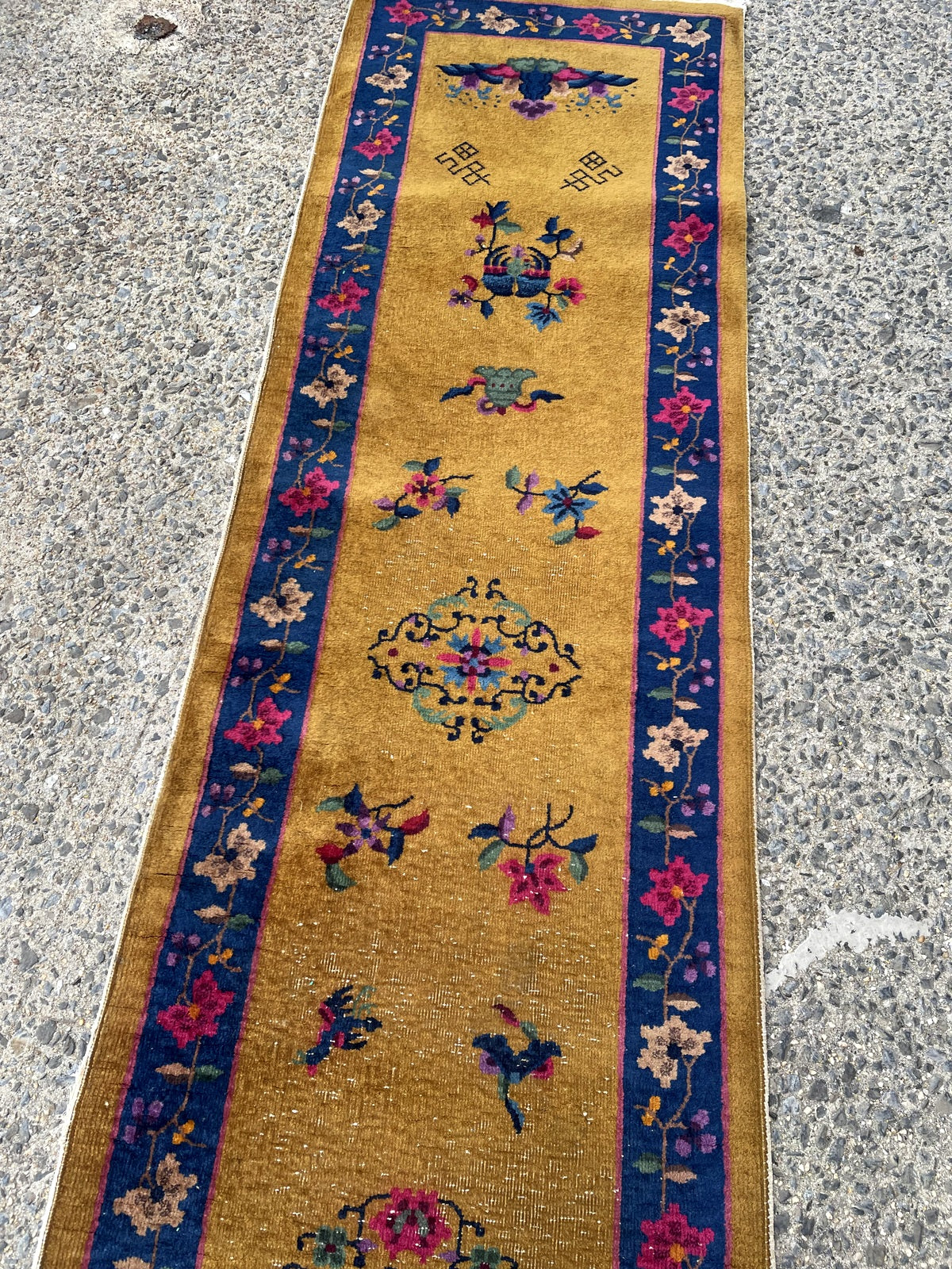 Vintage Chinese Nichols style runner from Tianjin with indigo blue border and floral sprays on floor

