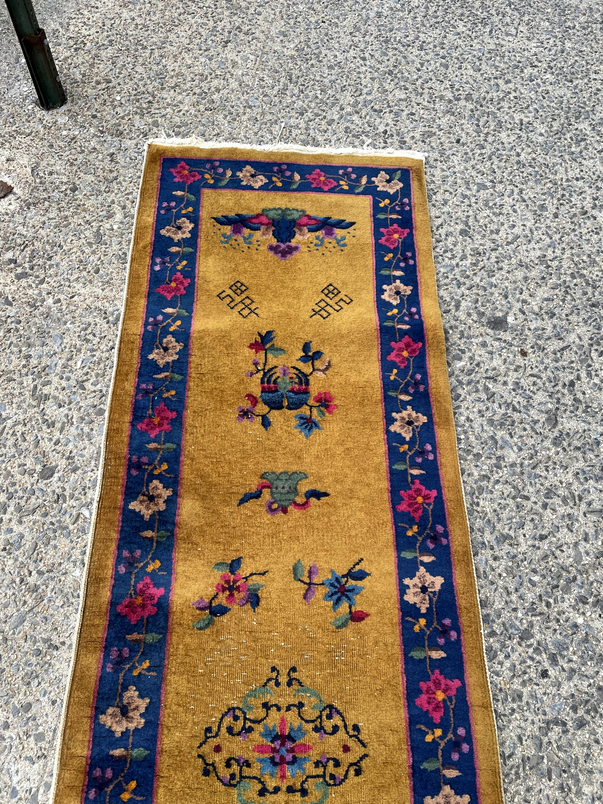 Long antique runner ideal for hallway entryway or behind sofa in interior setting with bold contrast

