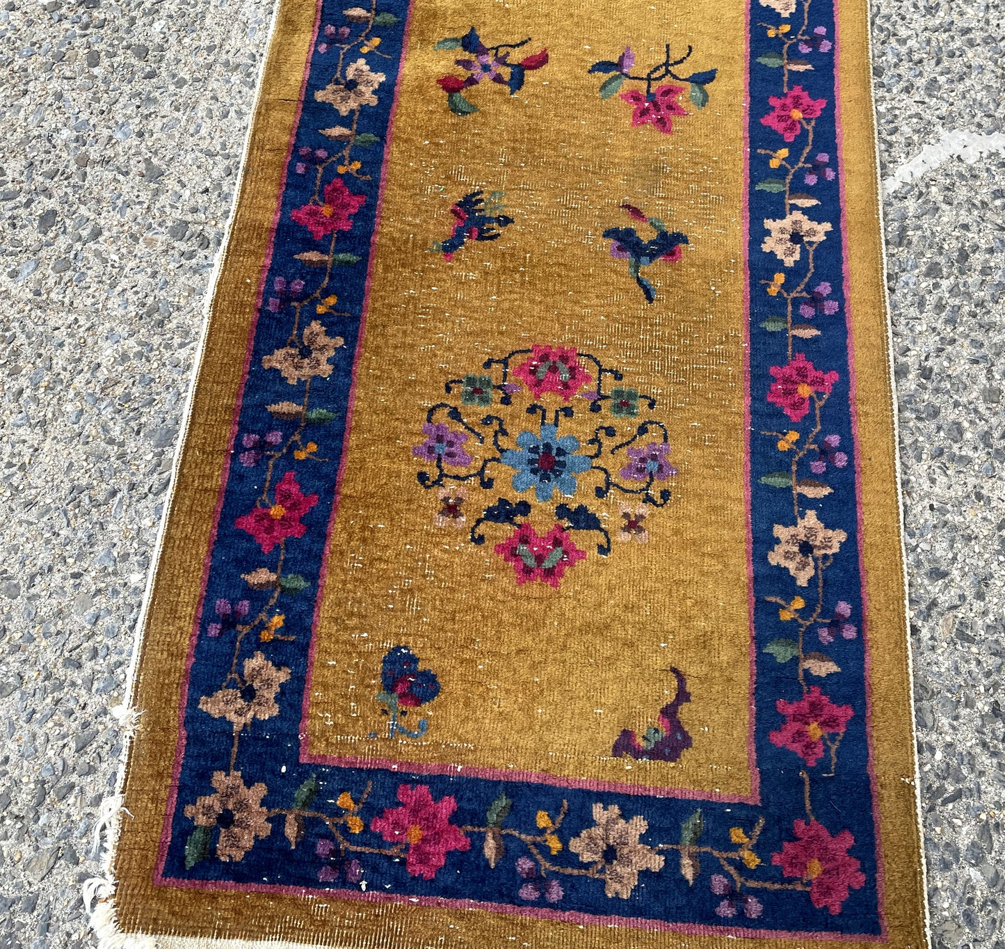 Close-up of butterfly motifs symbolizing joy and longevity in Chinese culture on antique runner