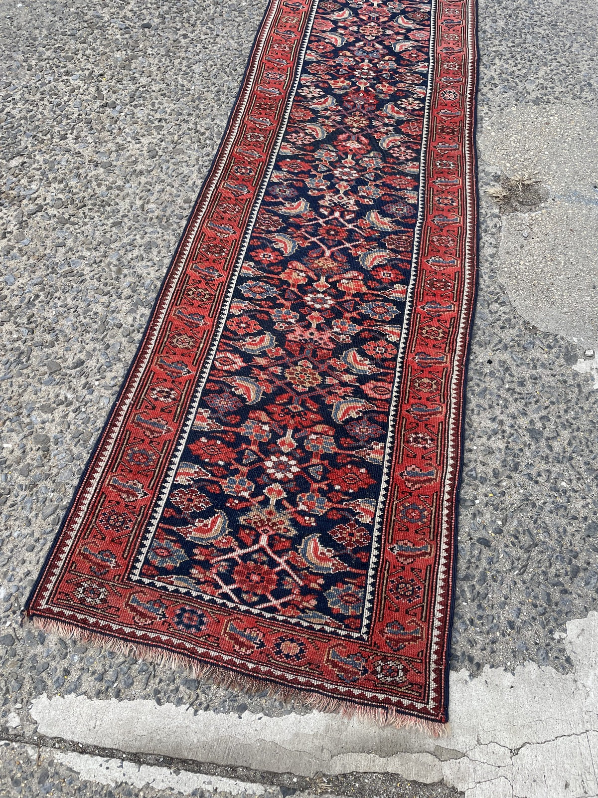 Vintage tribal runner from Northwest Persia with deep indigo field and Mina Khani design on grand hallway floor

