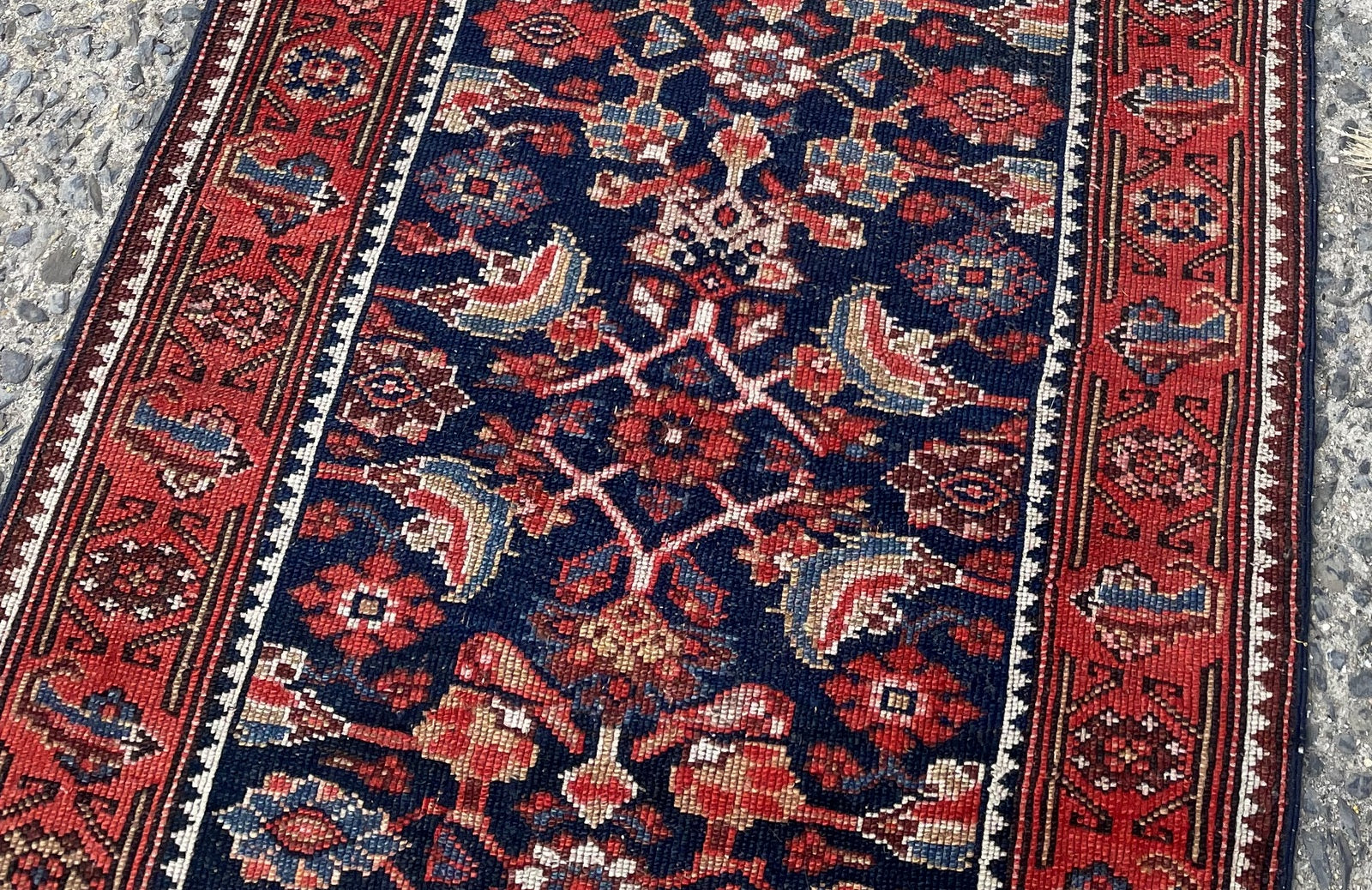 Handwoven Kurdish rug circa 1900-1910 with midnight indigo madder red terracotta and antique ivory colors

