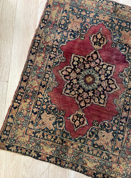 Museum-quality 19th century Persian Ravar district rug with Mill-Fleur thousand flowers design on display

