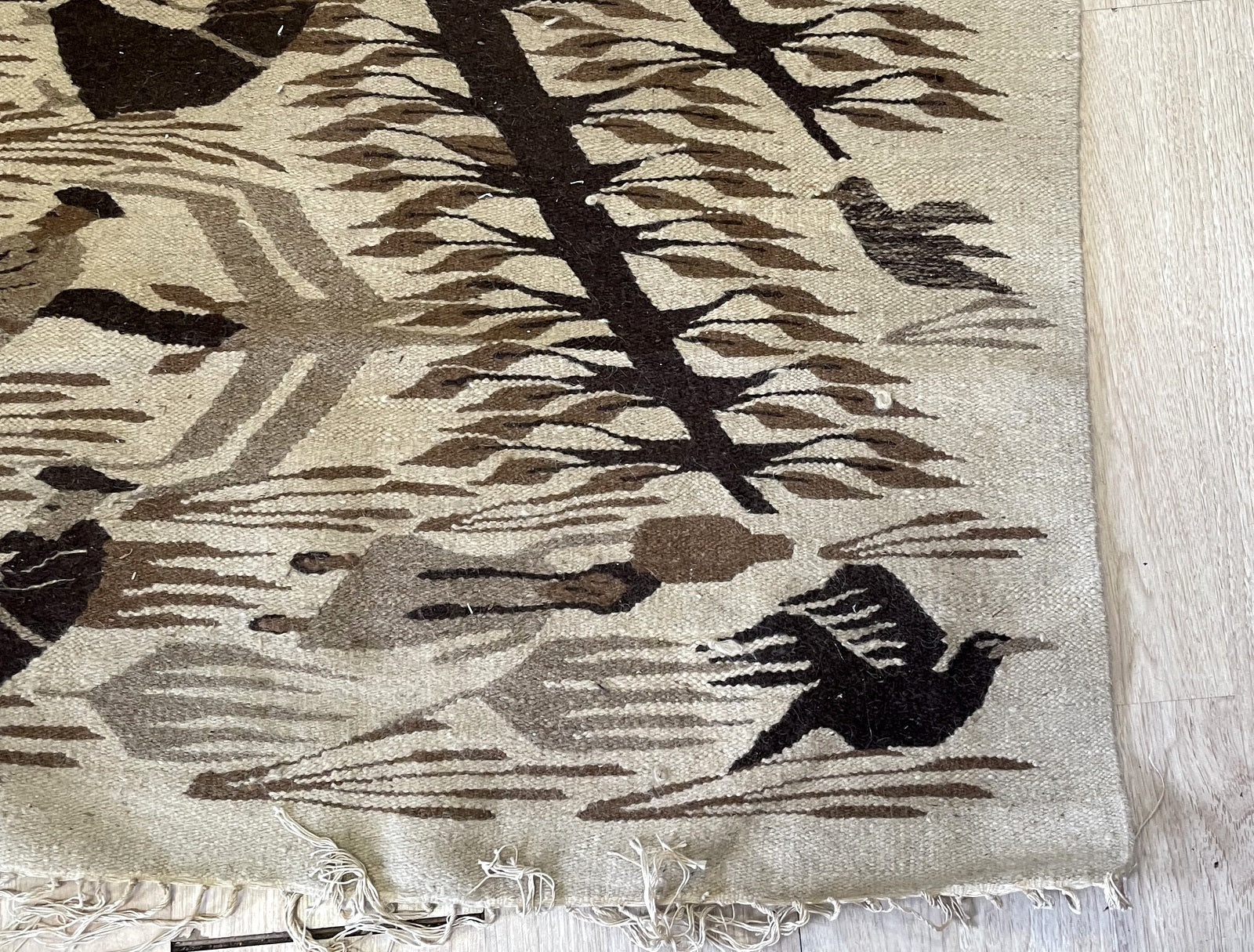 Complex centered Diamond of the Sun medallion on vintage Mexican flatweave geometric rug
